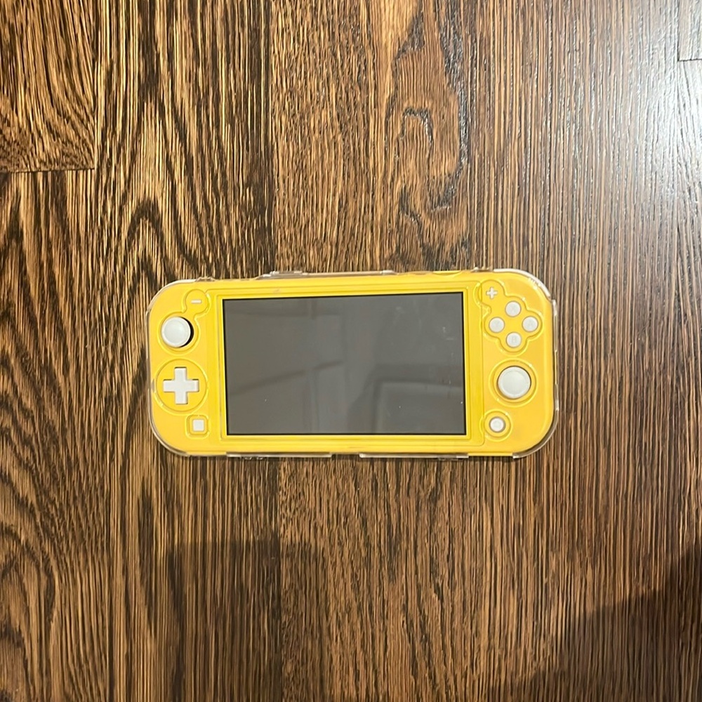 yellow nintendo switch lite with clear protective case